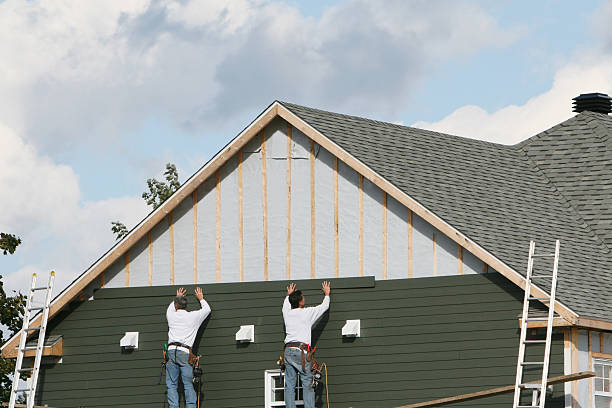 Professional Siding technician working in Plainview, NY